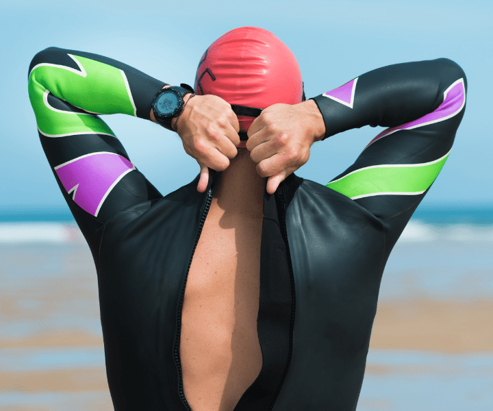 person putting on a wet suit