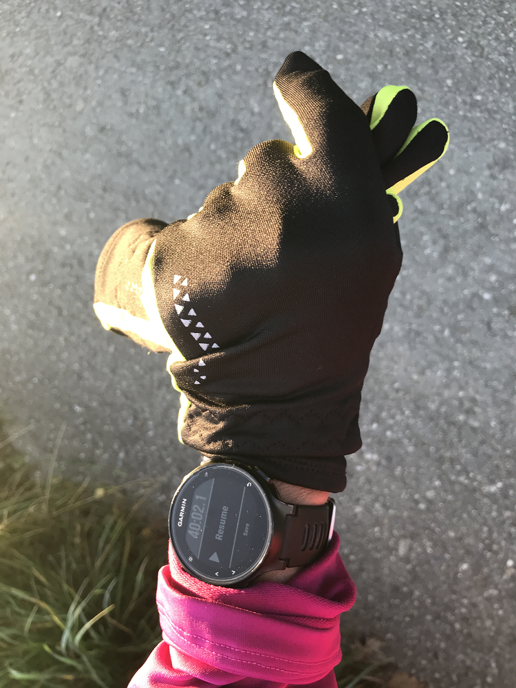 black sports glove on a hand with a sports watch on the wrist #runningmotivation #fitnessat50 #happyrunner