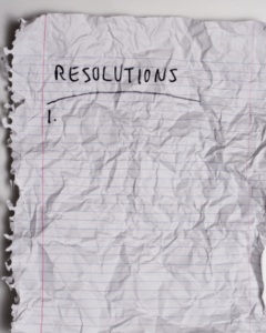 scrunced up piece of paper with resolutions written on it